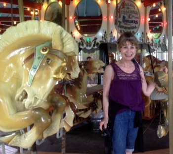 OP-ED: There Is No Breeze Like The Breeze On A Carousel Shelly Reuben on the Carousel in West Endicott Park. Photo by Doreen Davis